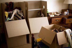 Boxes and clothing being packed ready for removal.